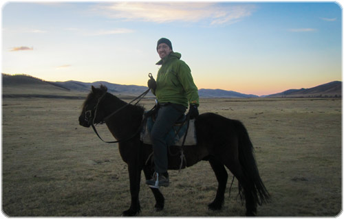 Smug Stu in the back of beyond on a rather small looking horse - Mongolia