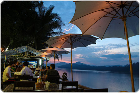 Watching a beautiful sunset over the Mekong River in one of Luang Prabang's many riverside restaurants