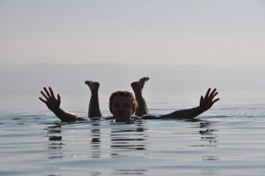 woman floating dead sea