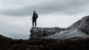 man standing on rock